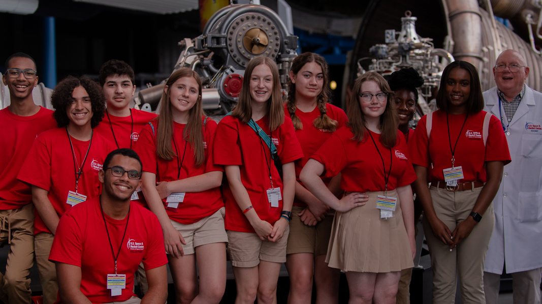 A docent leads a tour through the Davidson Center for Space Exploration